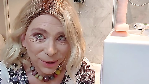 Horny blonde in hotel room gets ass fucked by a dildo