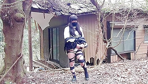 Dirty brunette masturbating outdoors in an abandoned house