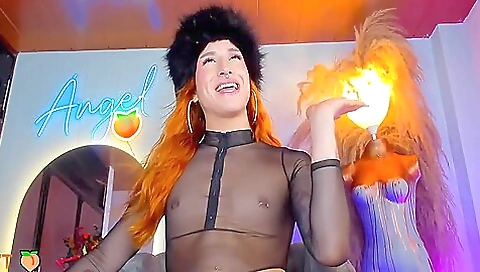 Busty redhead with a tattooed cunt is masturbating